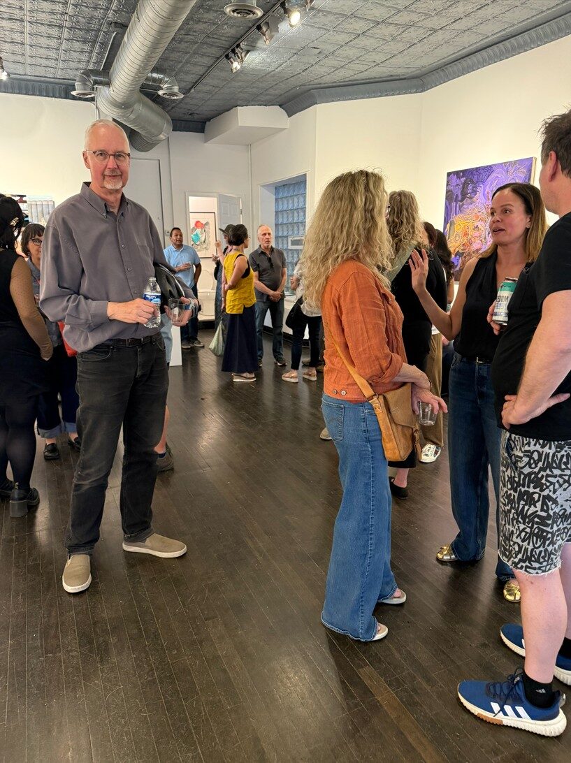 Crowd mingling in Oliva Gallery during the Art In Transit opening