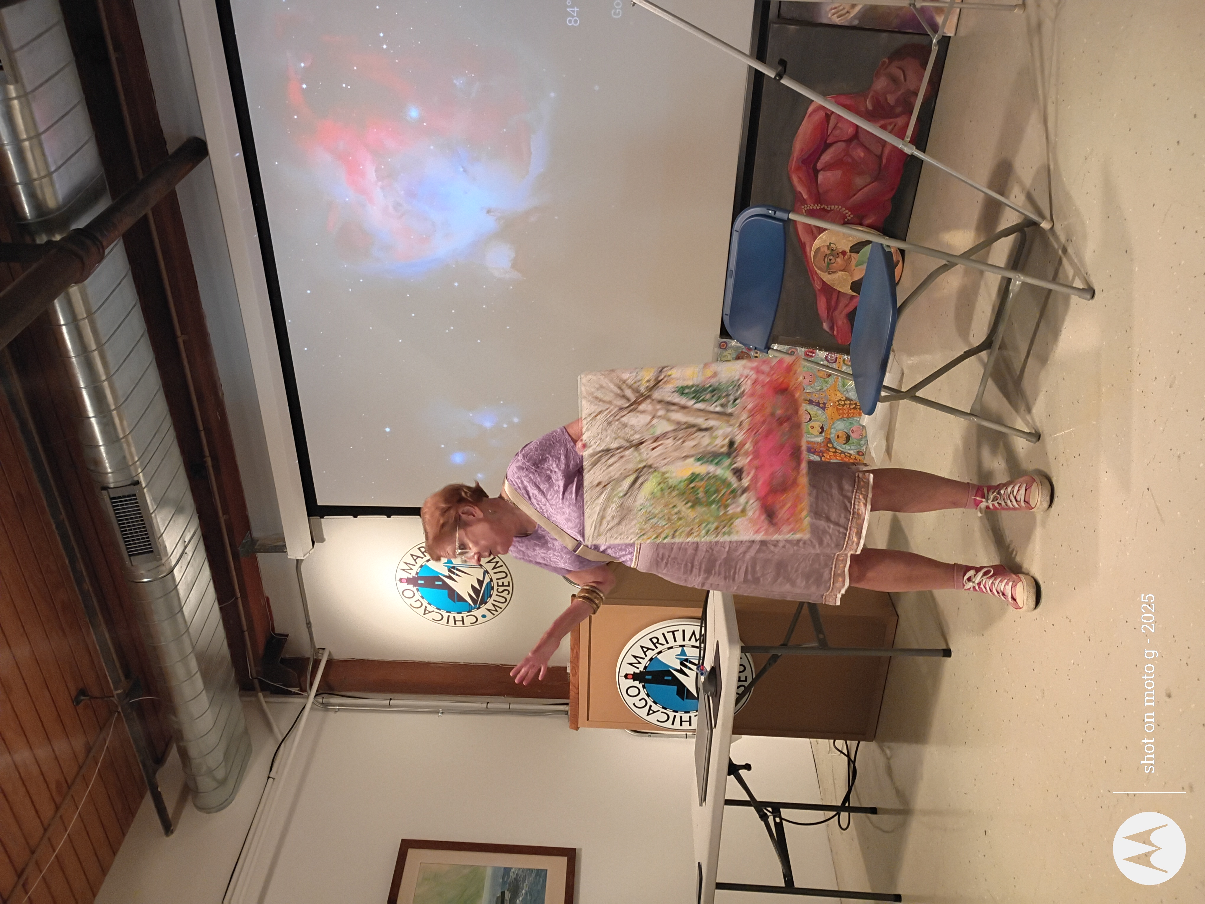 Art Salon artist presenting landscape painting