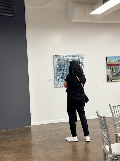Our Kind of Town visitor viewing gallery artwork