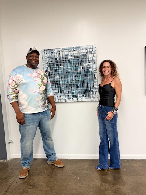 Our Kind of Town artist and guest with artwork