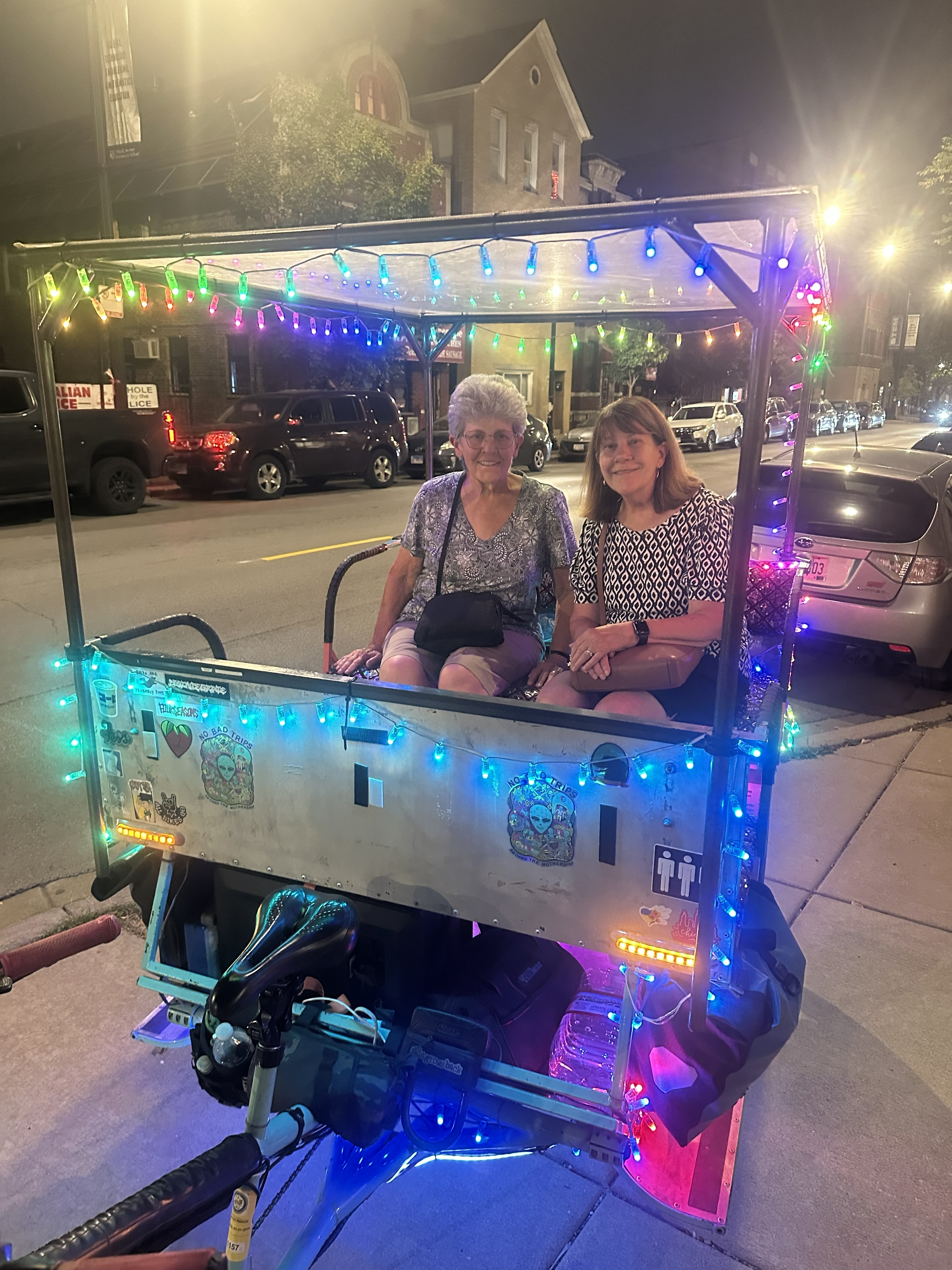 Third Friday Free Pedicabs riders at night