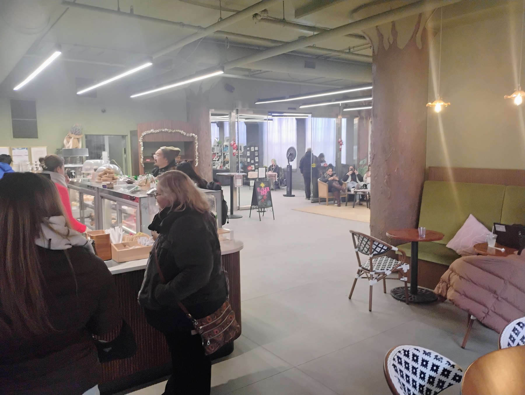 Vjosa Market cafe and event space with guests